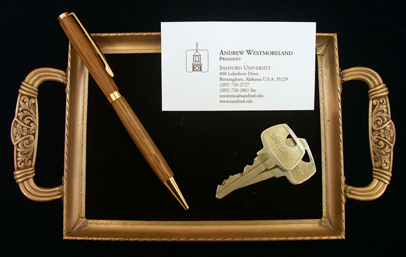 business card, keys and pen